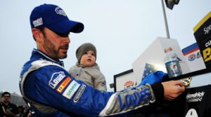 Jimmie Johnson putting Chase decal on at Atlanta 2015