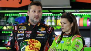 DAYTONA BEACH, FL - FEBRUARY 18: (L-R) Tony Stewart, driver of the #14 Bass Pro Shops/Mobil 1 Chevrolet, and Danica Patrick, driver of the #10 GoDaddy Chevrolet, talk in the garage area during practice for the 57th Annual Daytona 500 at Daytona International Speedway on February 18, 2015 in Daytona Beach, Florida. (Photo by Brian Lawdermilk/Getty Images)